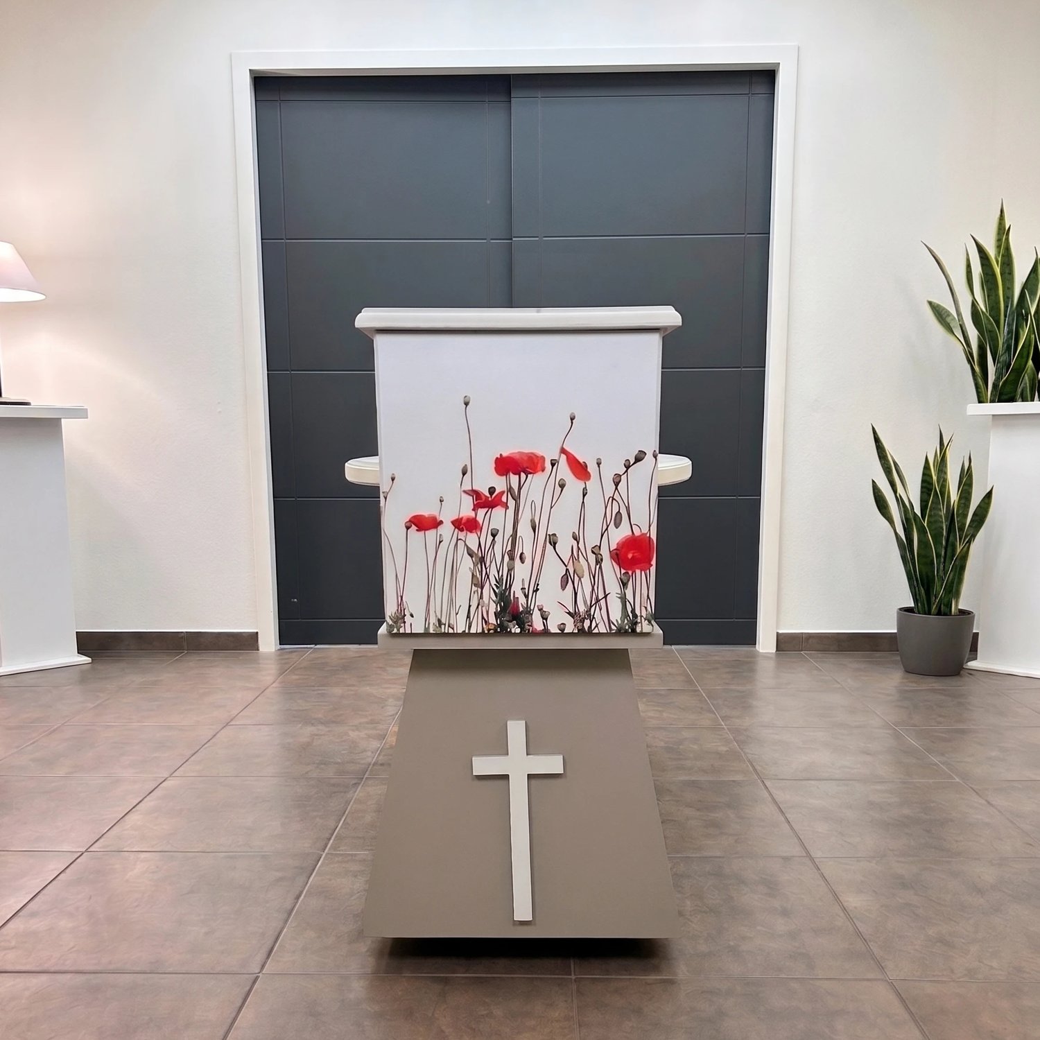 L'Universel installed at a client's, with floral covering and a cross emblem
